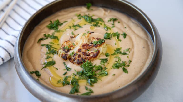 creamy cauliflower soup in a bowl.