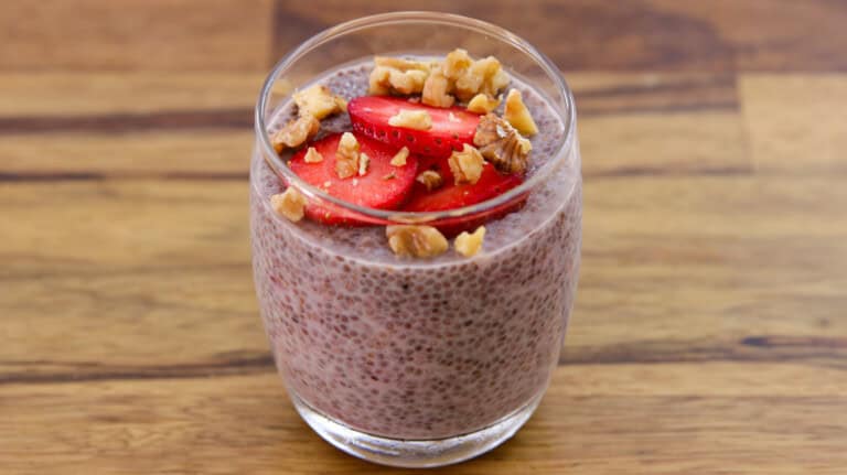 a glass of strawberry chia pudding