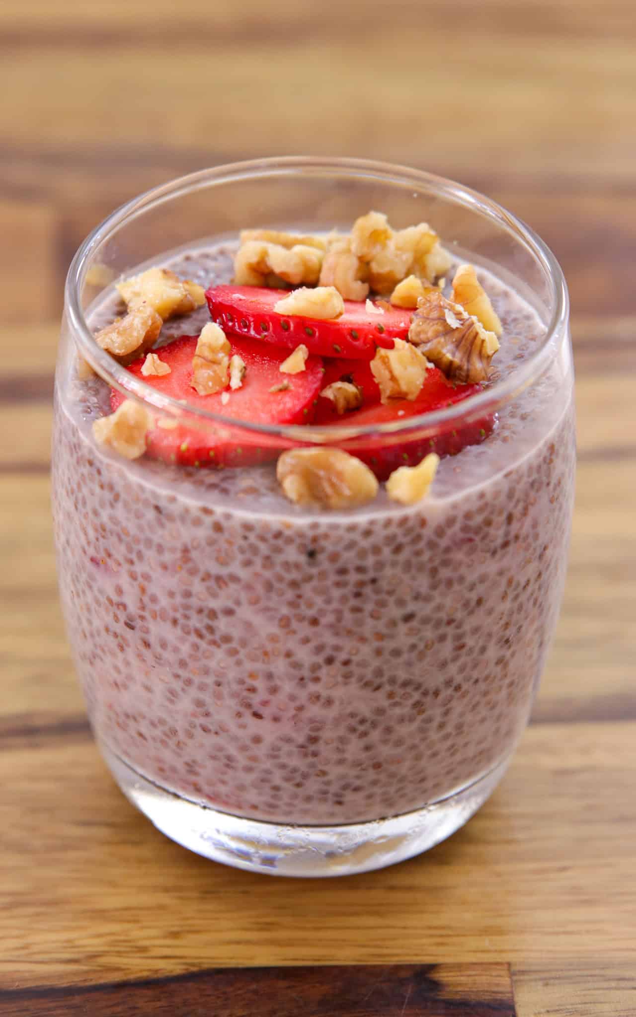 a glass with strawberry chia pudding.