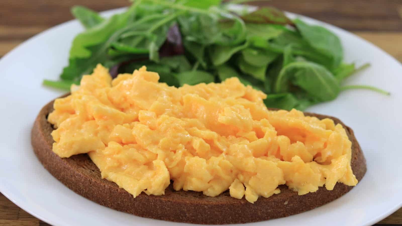 scrambled eggs on a brown bread