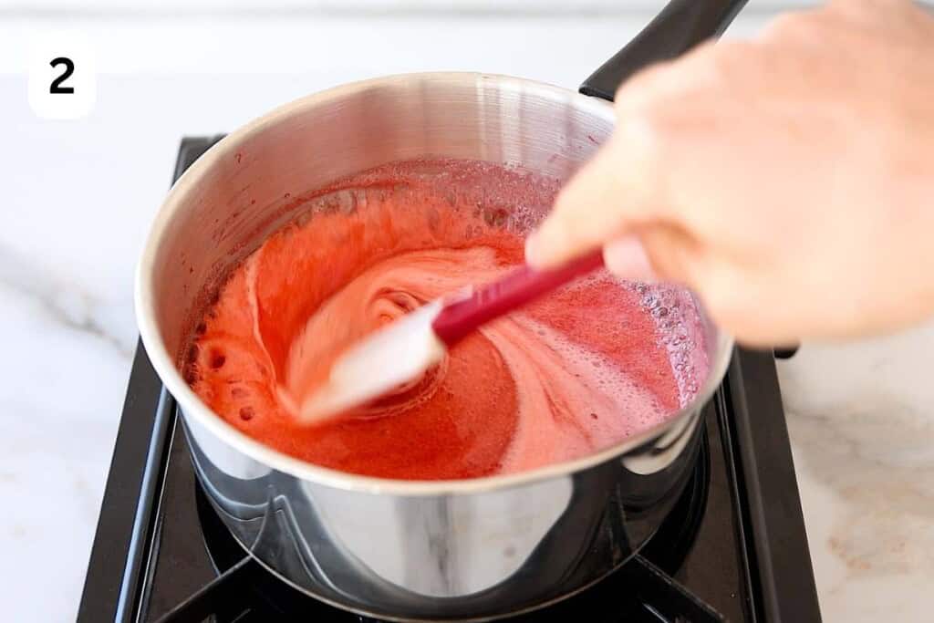 simmering strabwerry puree in a small saucepan.