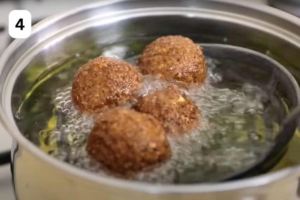 deep frying falafels in oil.