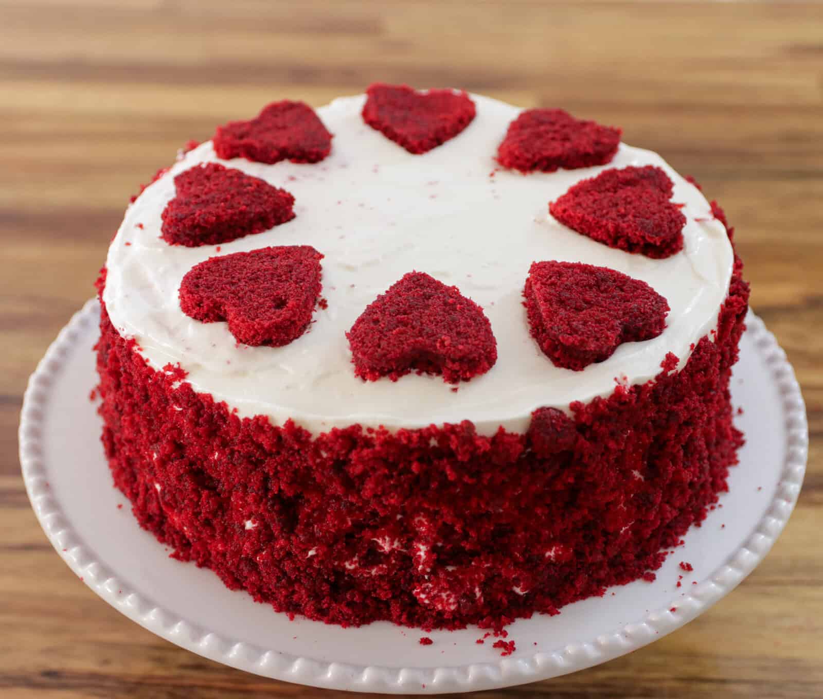 A red velvet cake with heart shape decoration