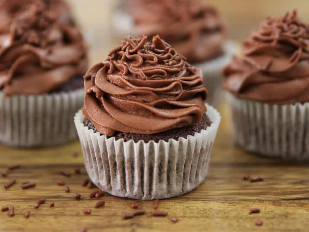 chocolate cupcakes on a table.