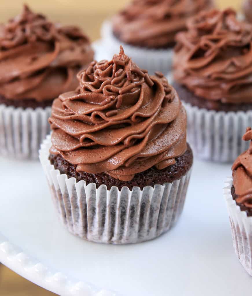 chocolate cupcake with buttercream on a table.