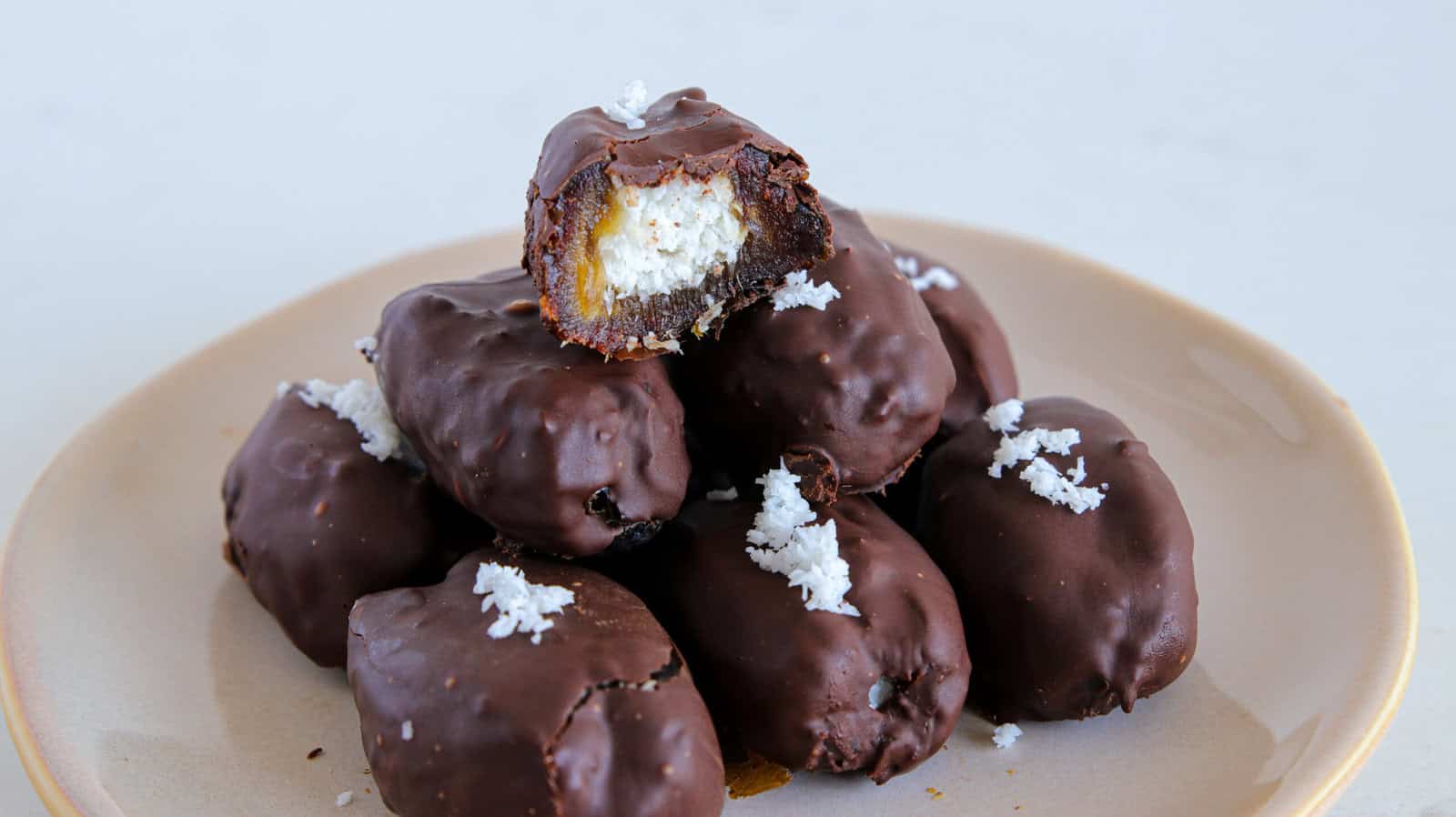 dates filled with coconut and covered with dark chocolate