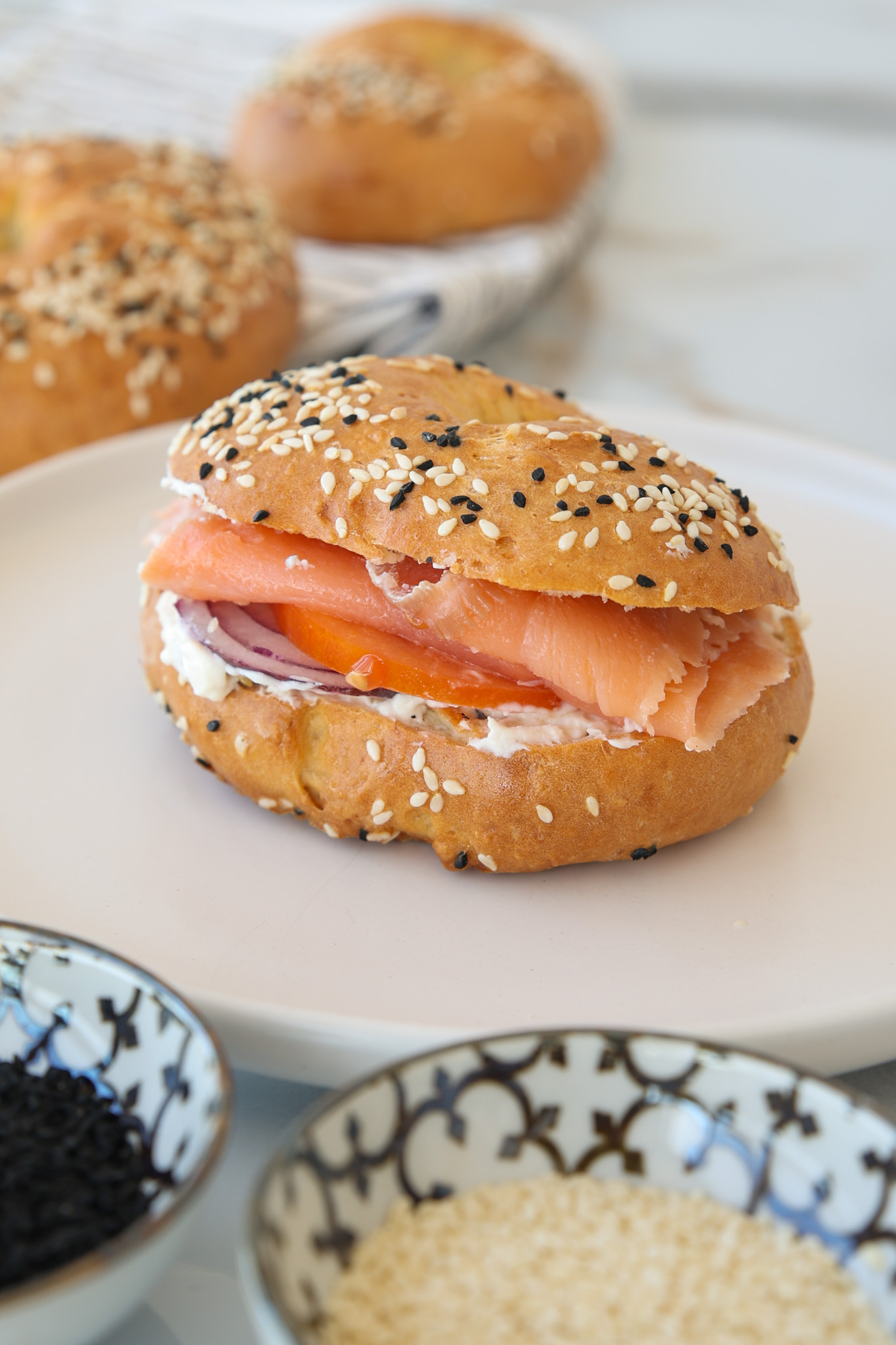 cottage cheese bagel with cream cheese, smoked salmon, tomato and onion