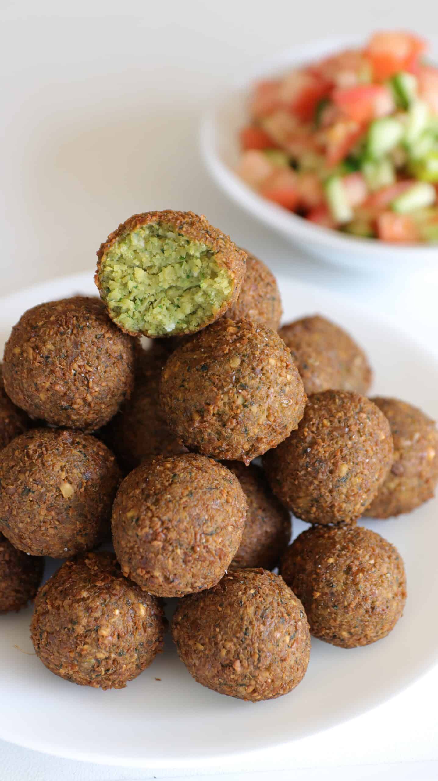 stack of falafel on a plate.