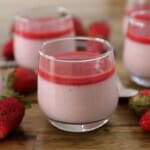 strawberry panna cotta in glasses on a table.