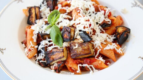 pasta alla norma on a plate topped with ricotta salata.