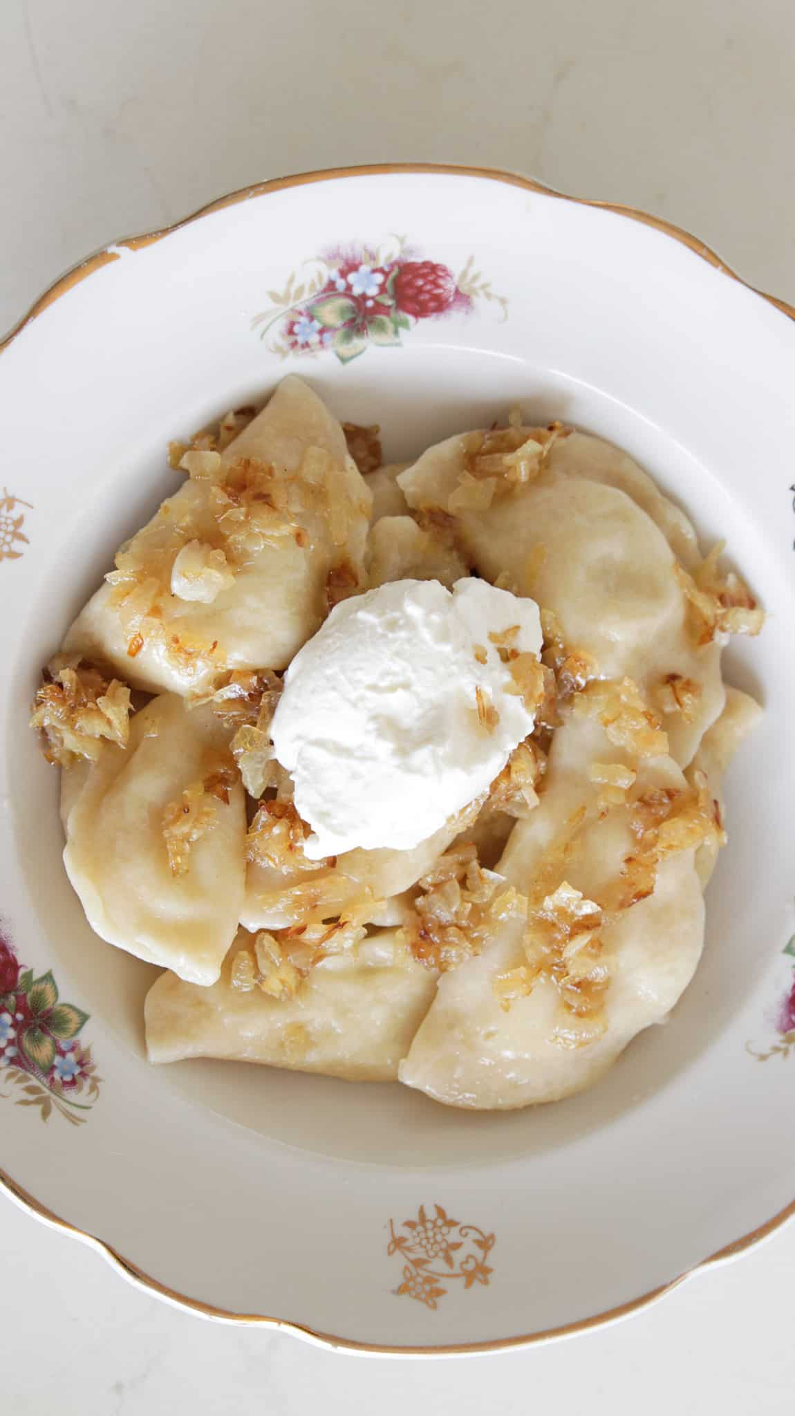 an overview on homemade pierogi recipe served with caramelized onion