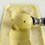 green creamy pistachio ice cream is being scooped