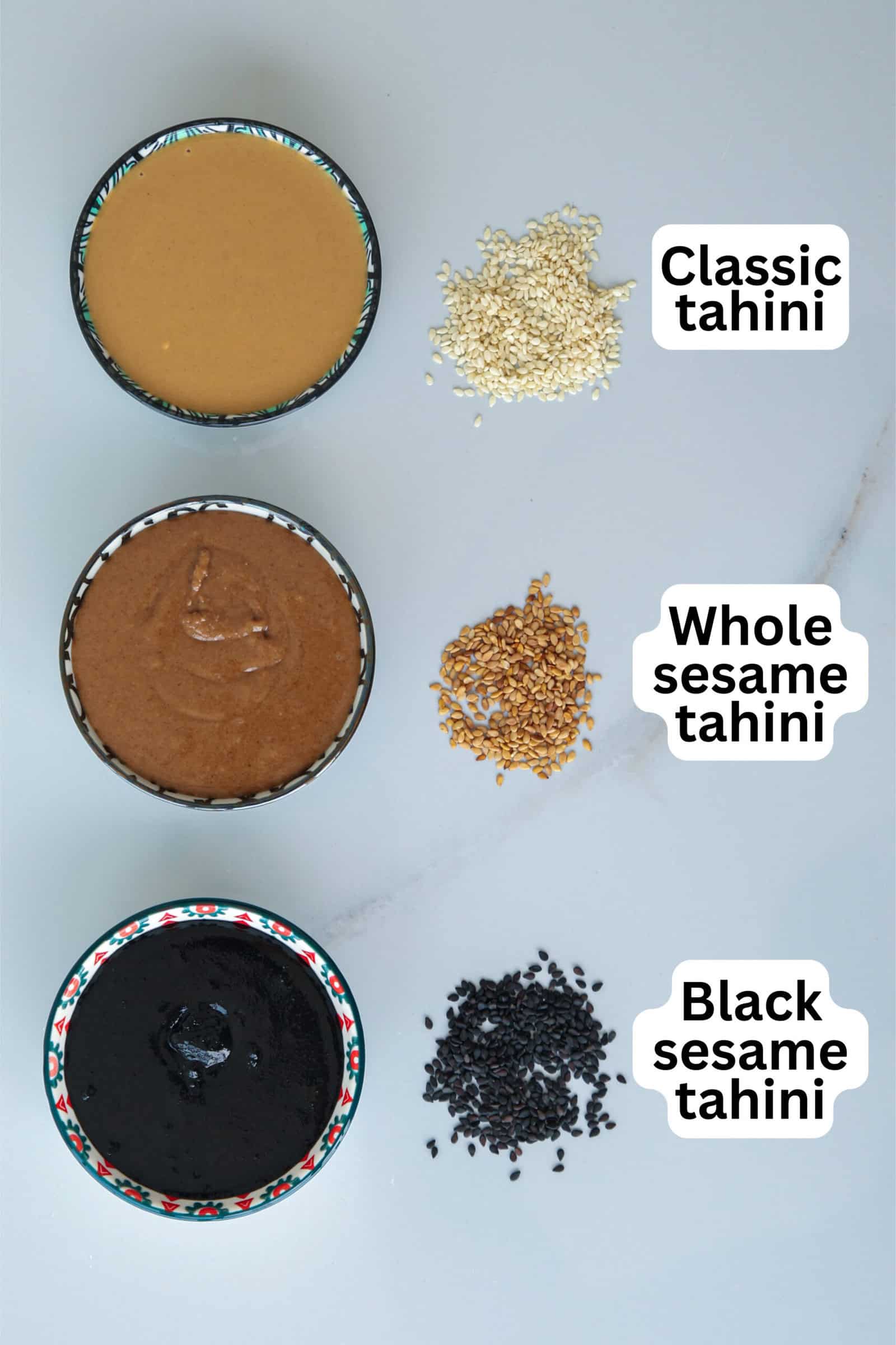 Three bowls of tahini are shown: at the top classic tahini with white sesame seeds, in the middle whole sesame tahini with brown seeds, and at the bottom black sesame tahini with black seeds. Labels identify each type.