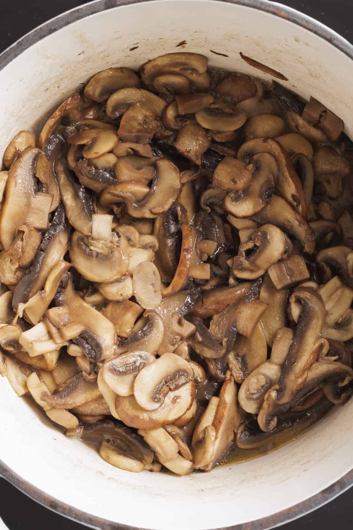 A pot full of browned mushrooms.