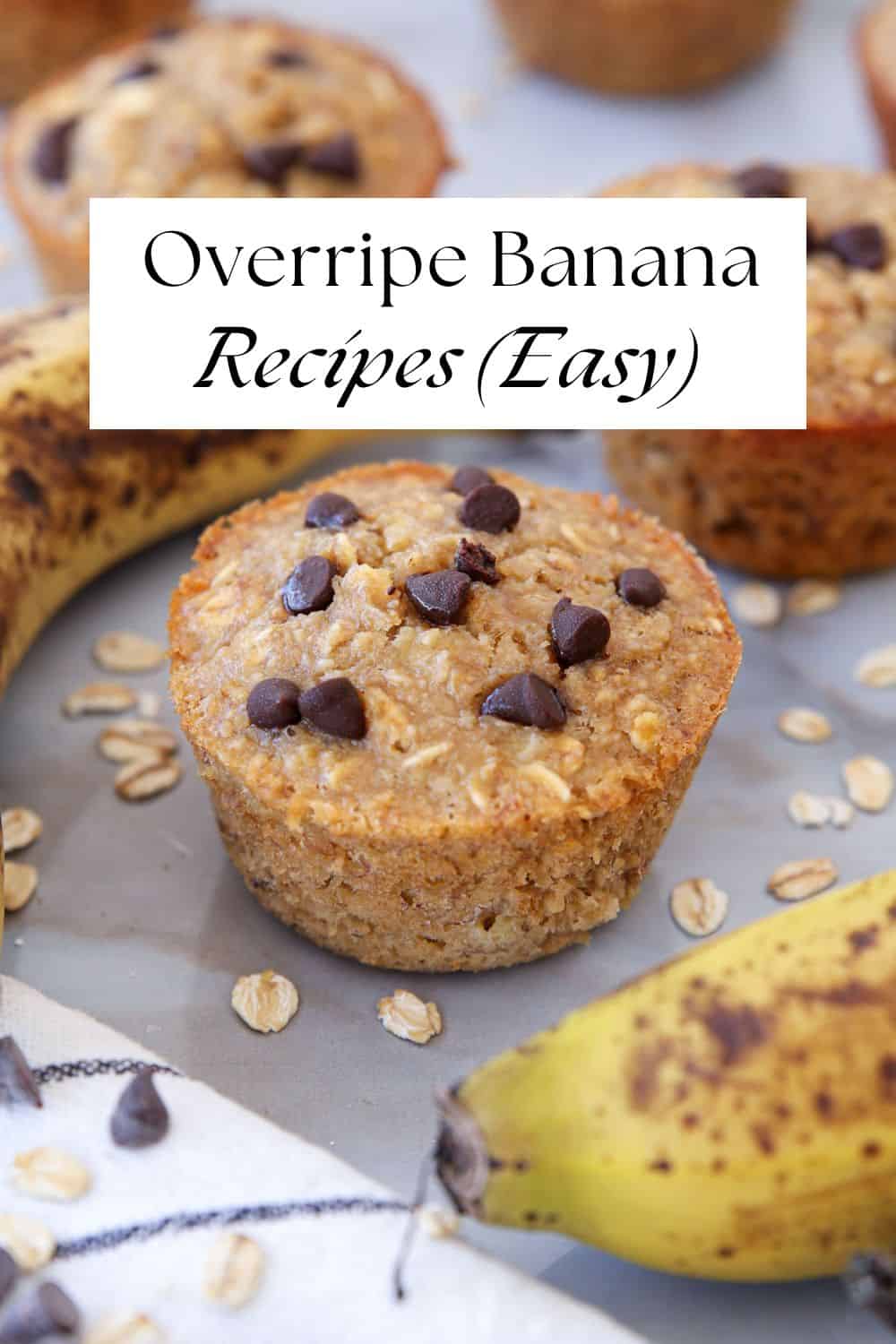 A banana oat muffin topped with chocolate chips sits on a surface with overripe bananas and scattered oats. Text on the image reads: "Overripe Banana Recipes (Easy).
