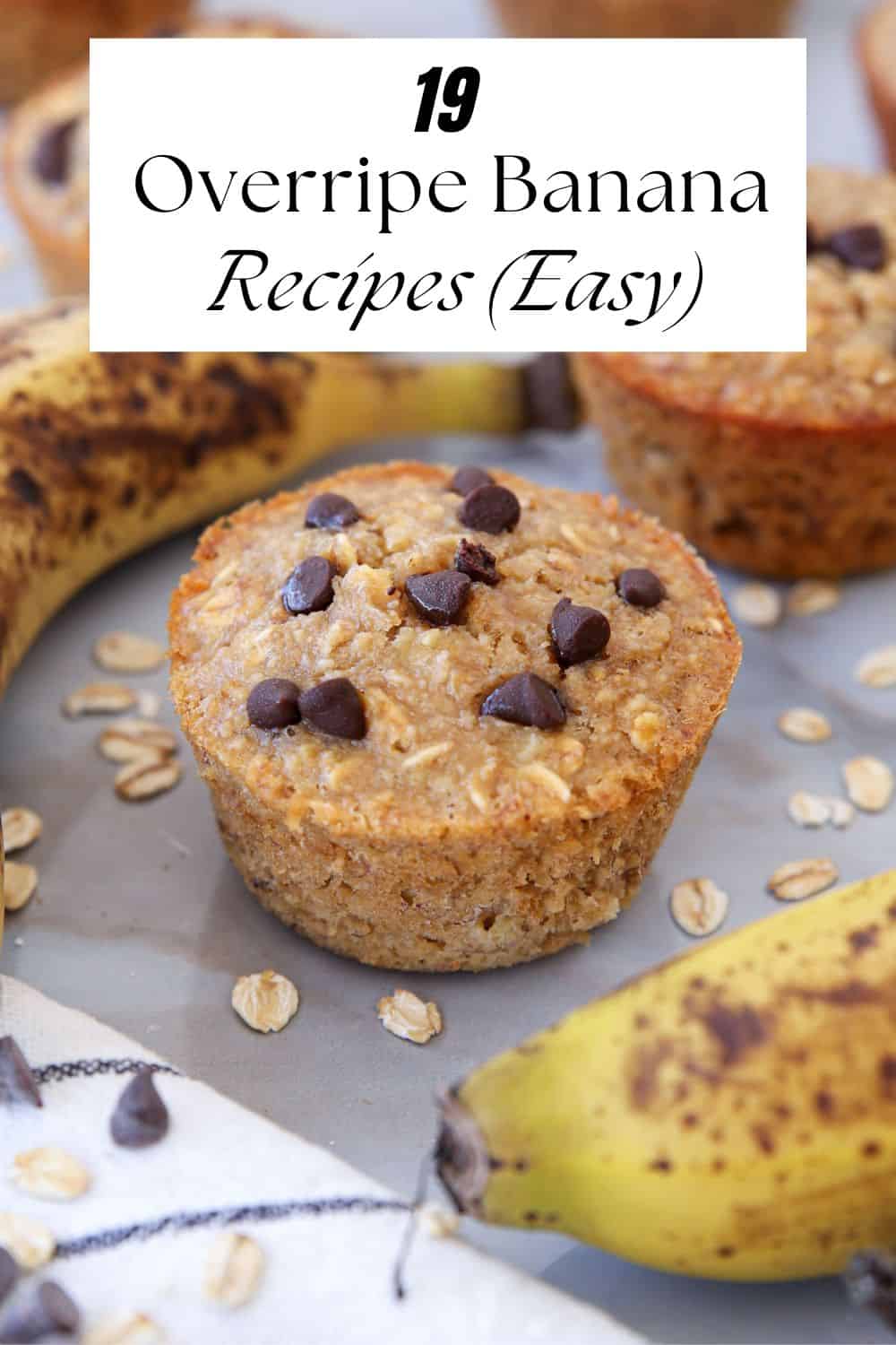 Close-up of banana muffins with chocolate chips, surrounded by overripe bananas and scattered oats. Text on image reads: “19 Overripe Banana Recipes (Easy)”.