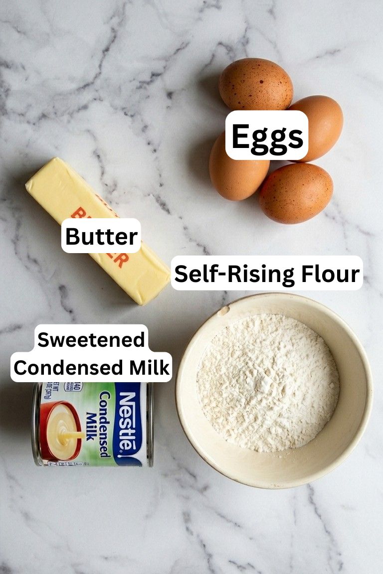 Top view of baking ingredients on a white surface: four brown eggs, a stick of butter, a bowl of self-rising flour, and a can of sweetened condensed milk. Each item is labeled.