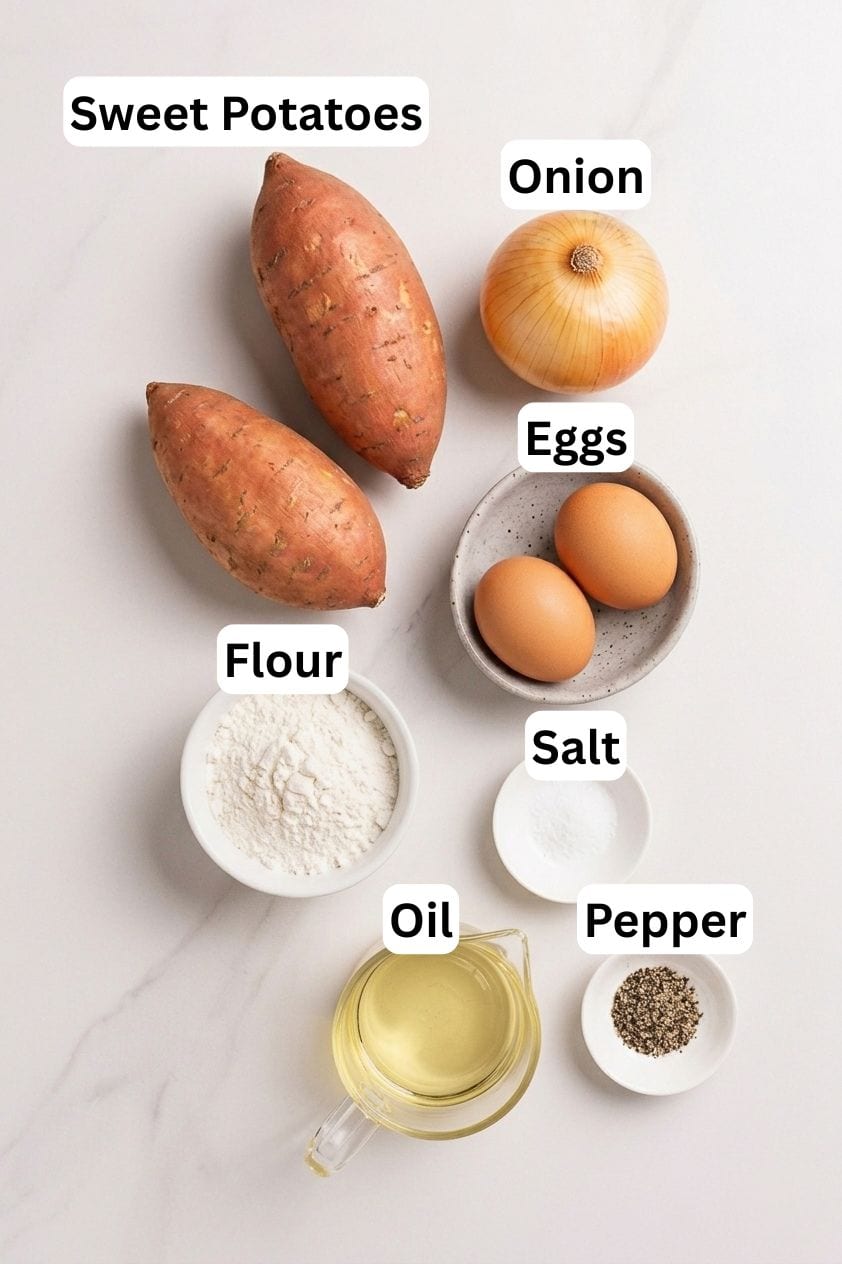 Two sweet potatoes, an onion, two eggs in a bowl, a bowl of flour, a small bowl of salt, a glass container of oil, and a small bowl of pepper are arranged on a white surface with labeled text.